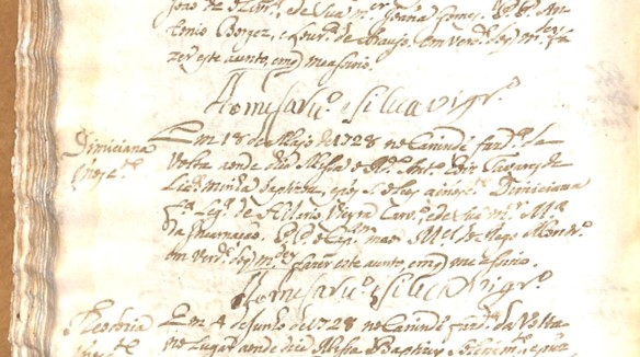 Página antiga com registro de batismo de Domiciana